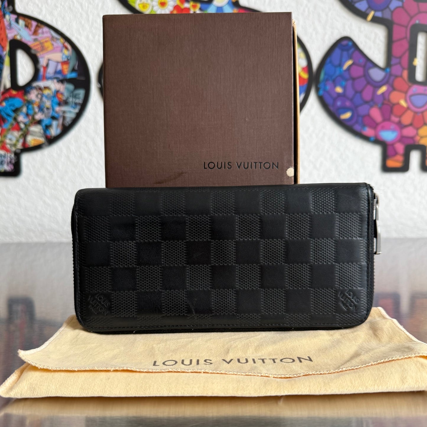 Louis Vuitton Zippy Vertical Infini Leder