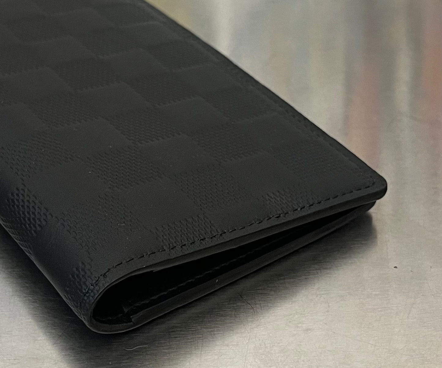 Louis Vuitton Brazza Infini Leder