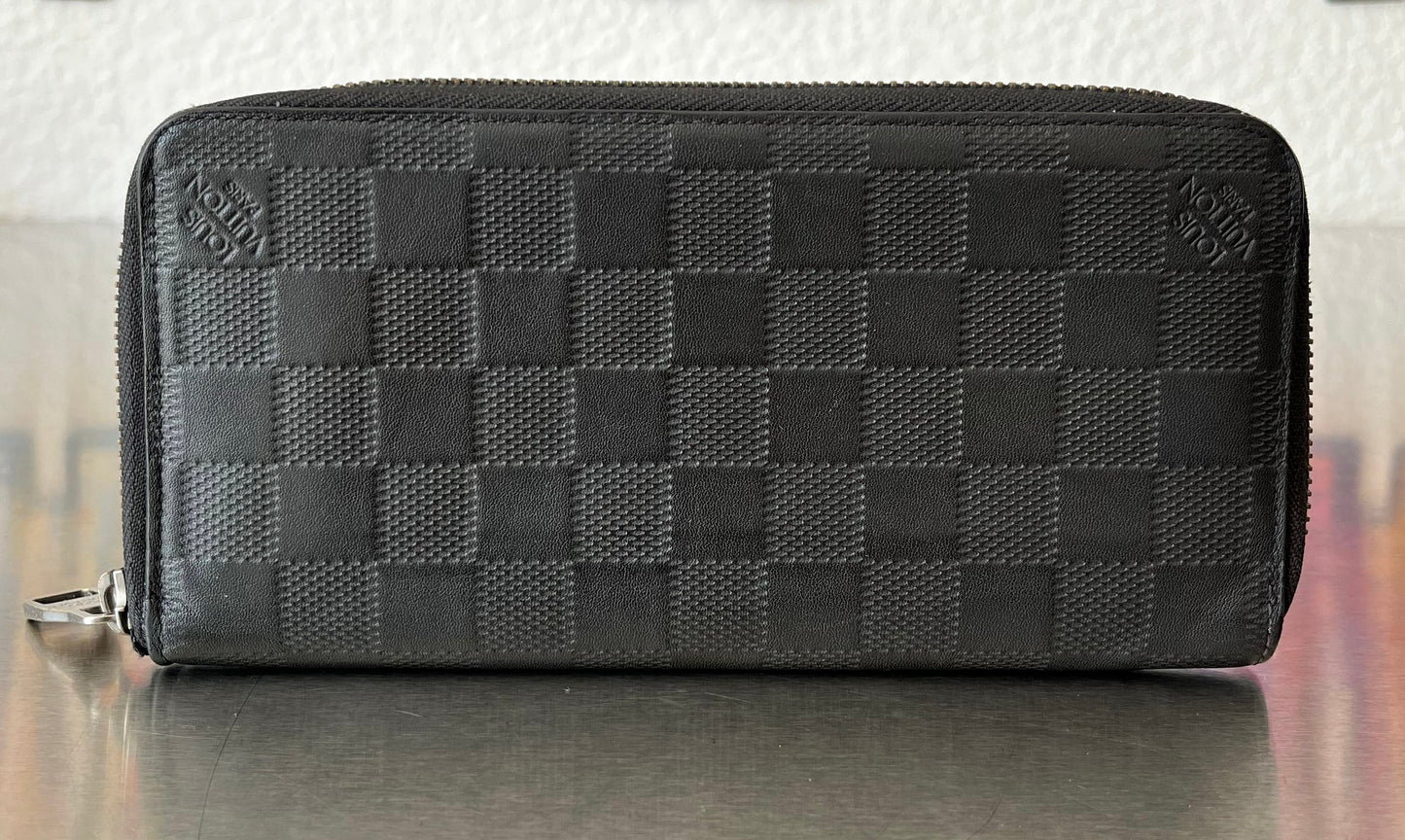 Louis Vuitton Zippy Vertical Infini Leder