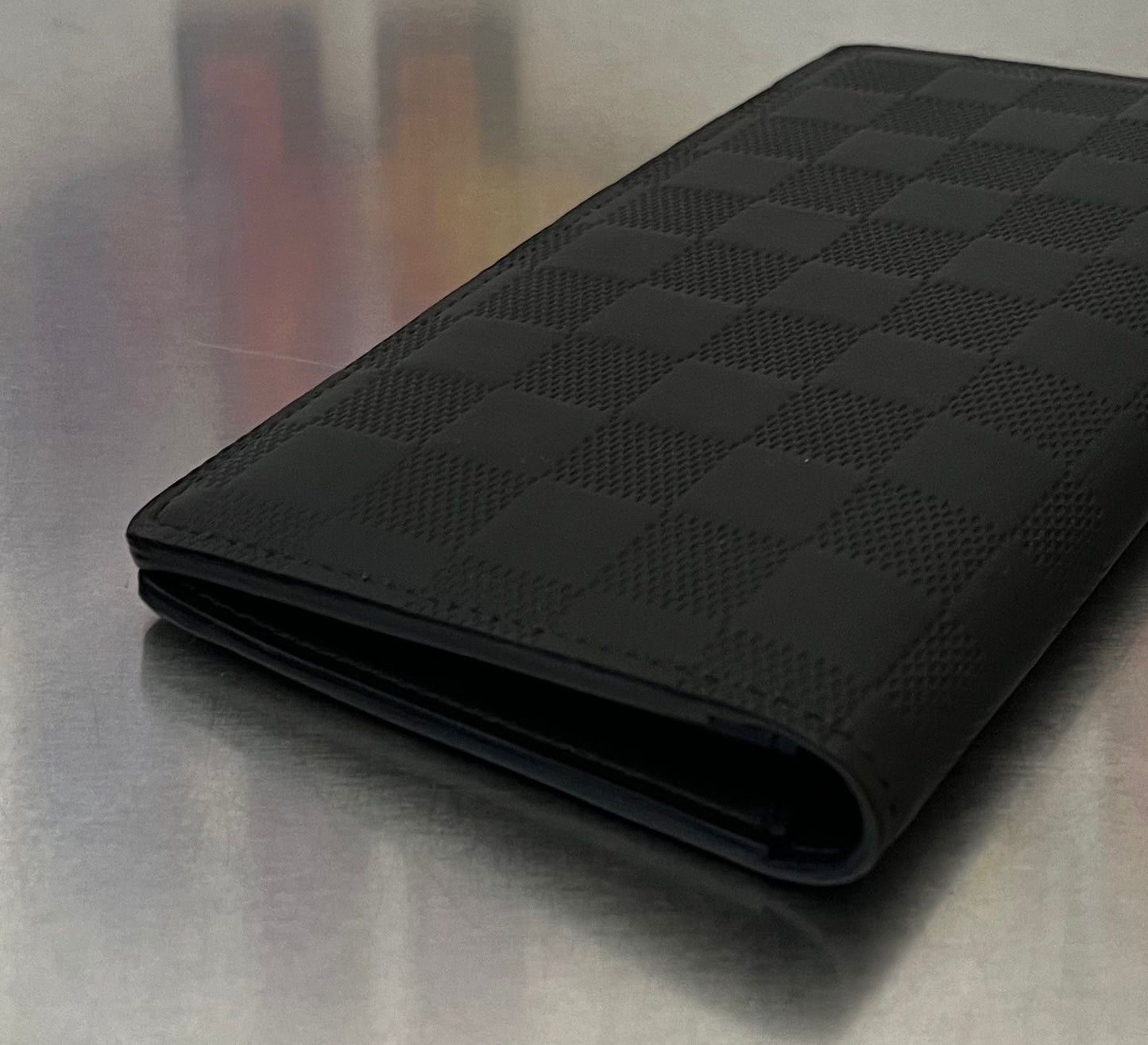 Louis Vuitton Brazza Infini Leder