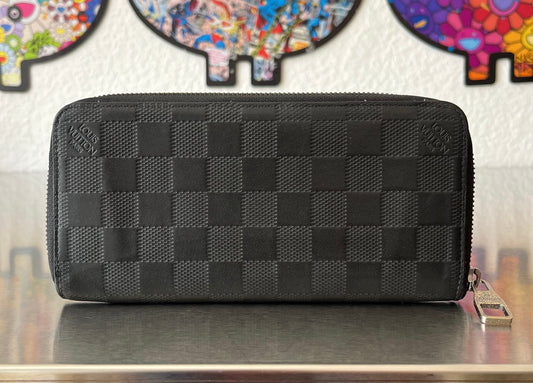 Louis Vuitton Zippy Vertical Infini Leder
