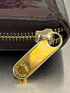 Louis Vuitton Zippy Lackleder
